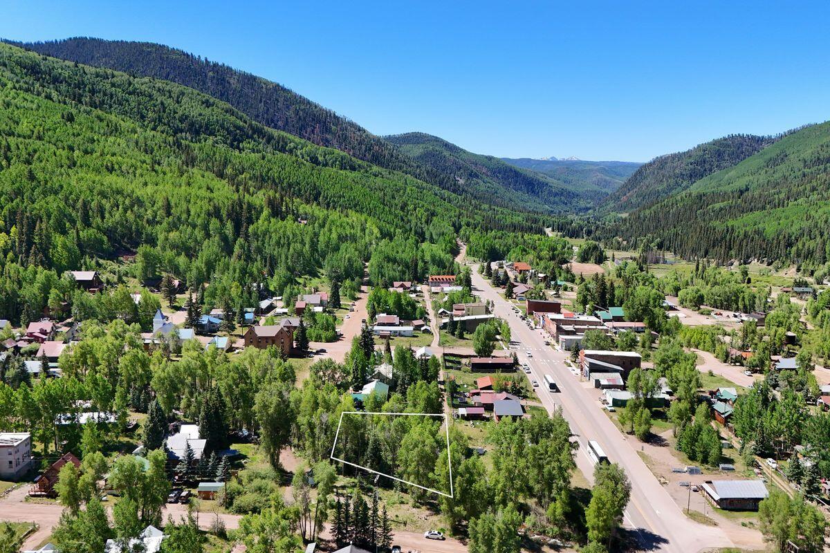 27 North Commercial Street Rico, CO 81332 - Photo 3 of 17 a view of a lush green hillside and houses