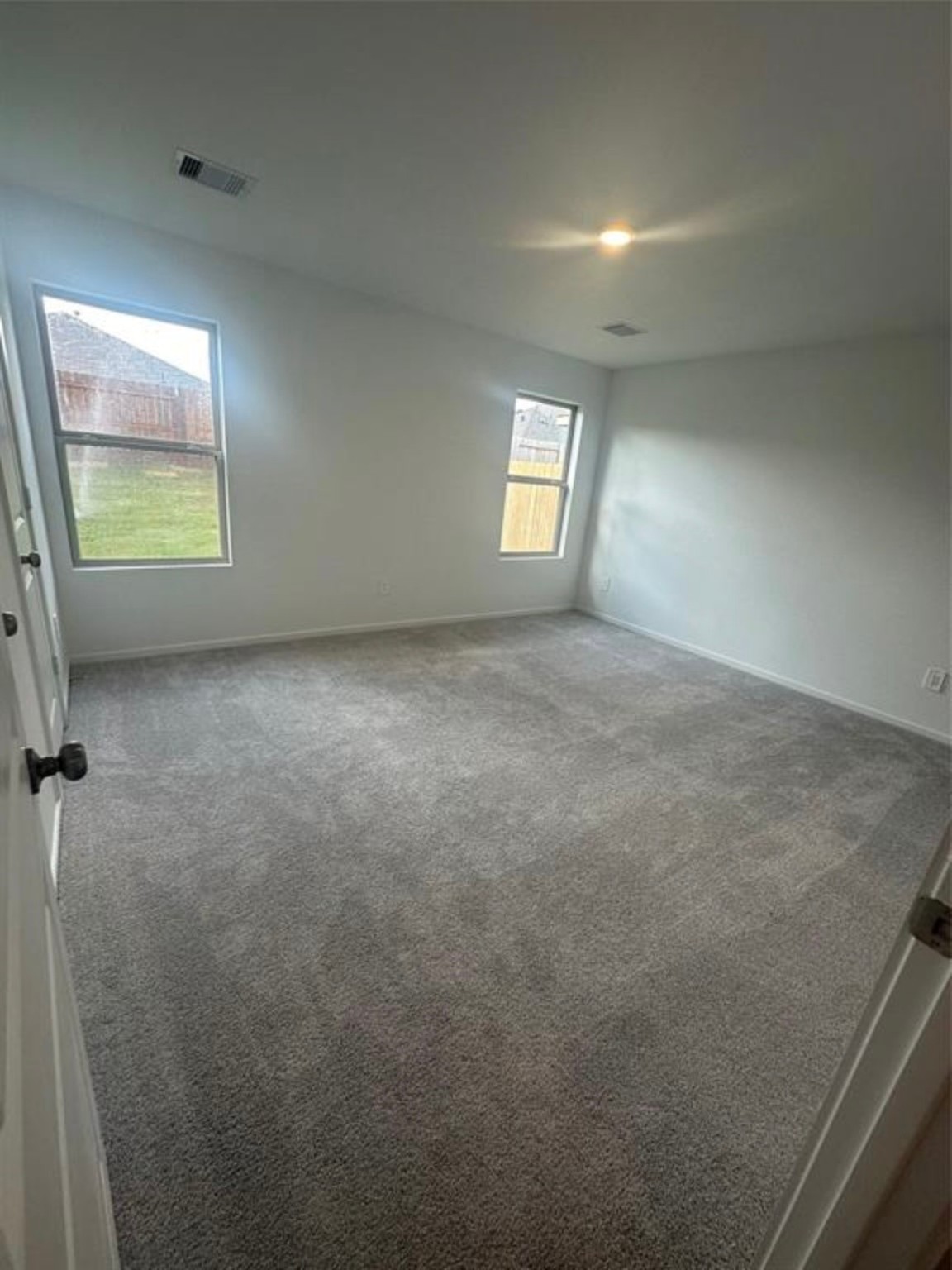 2621 Castille Valley Place Conroe, TX 77301 - Photo 6 of 10 an empty room with windows