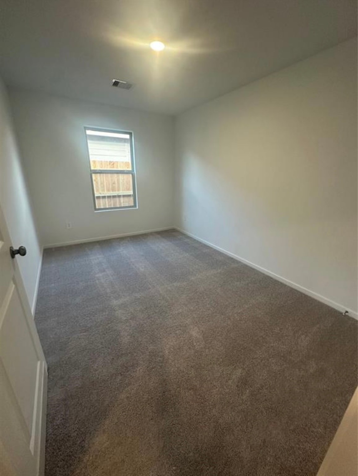 2621 Castille Valley Place Conroe, TX 77301 - Photo 7 of 10 an empty room with a window