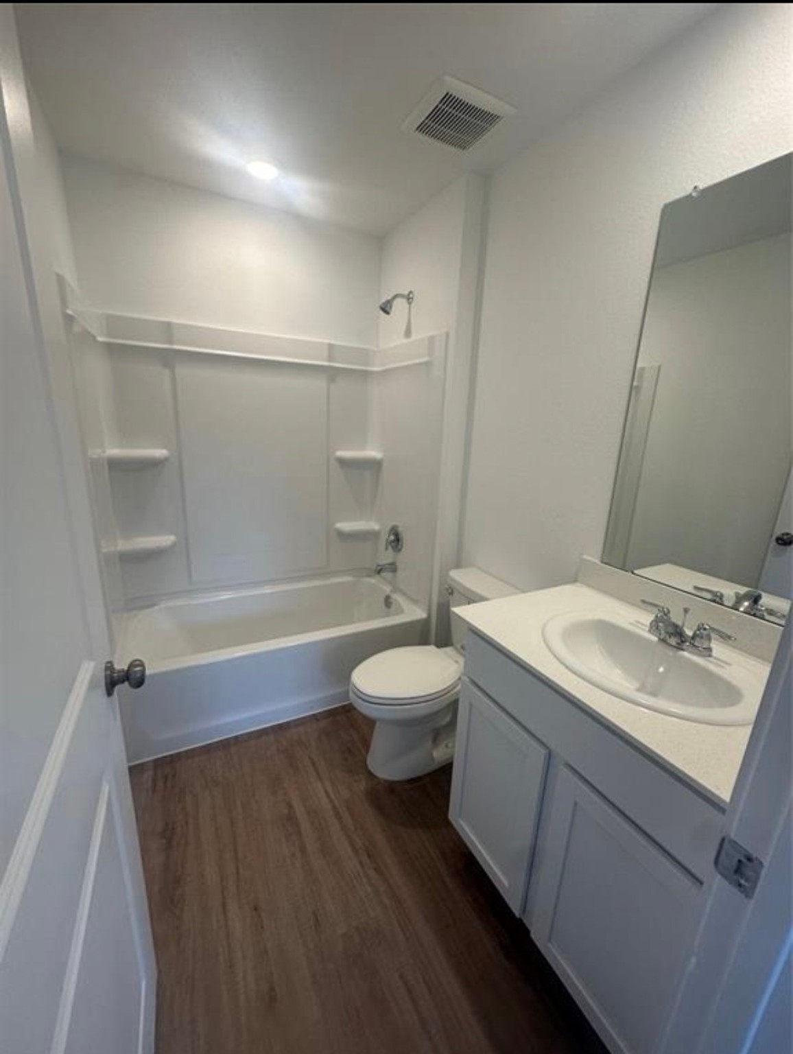 2621 Castille Valley Place Conroe, TX 77301 - Photo 8 of 10 a bathroom with a sink a toilet and shower