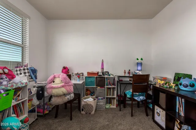 a bed room with a bed furniture and a window