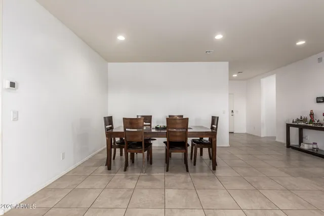 a kitchen with cabinets a sink and white appliances