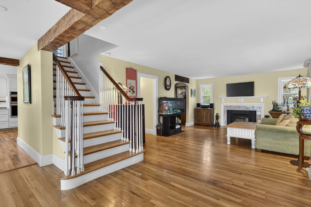 229 Parkerville Road Southborough, MA 01772 - Photo 29 of 38 a view of a livingroom with furniture a fireplace and wooden floor