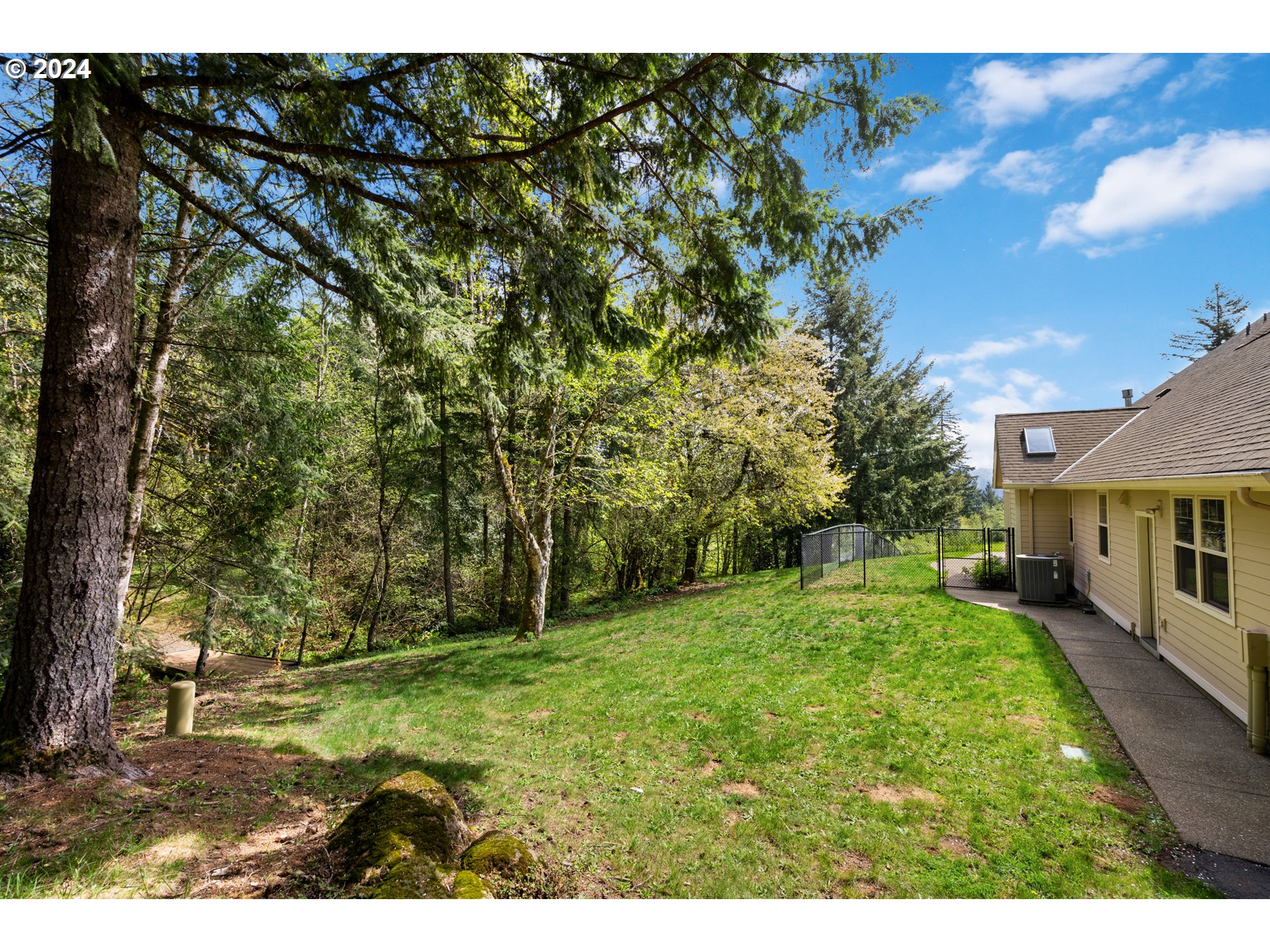 5924 Northeast Lessard Road Camas, WA 98607 - Photo 32 of 48 a backyard of a house with table and chairs