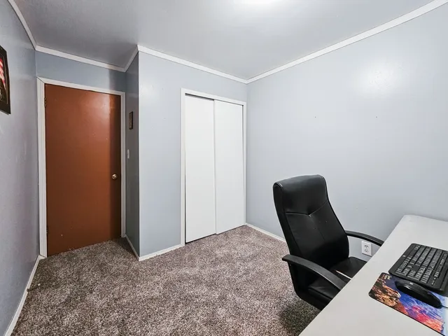 a view of workspace with furniture and a window