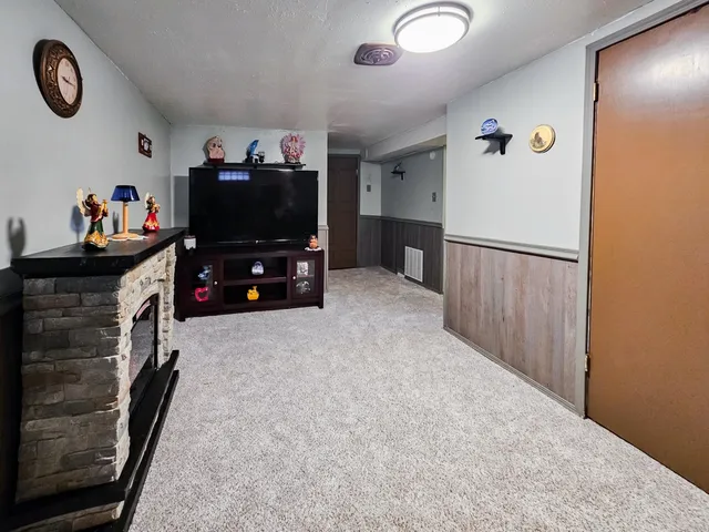 a view of livingroom with furniture and a flat screen tv