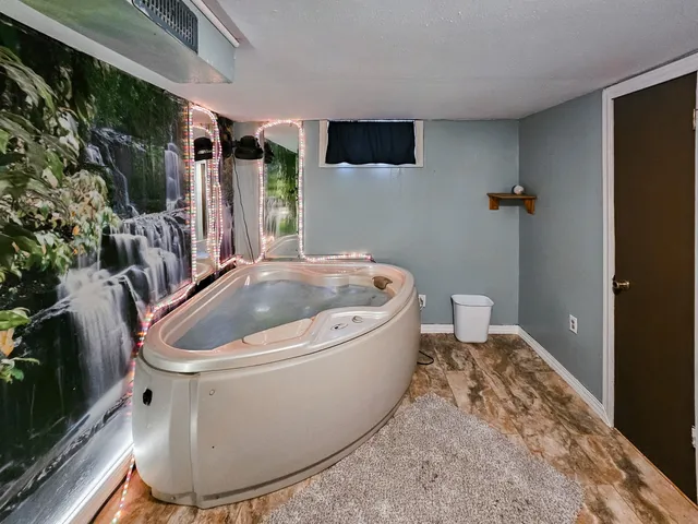 a white bath tub sitting in a bathroom