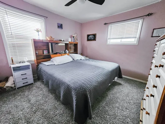 a bedroom with a bed and a tv