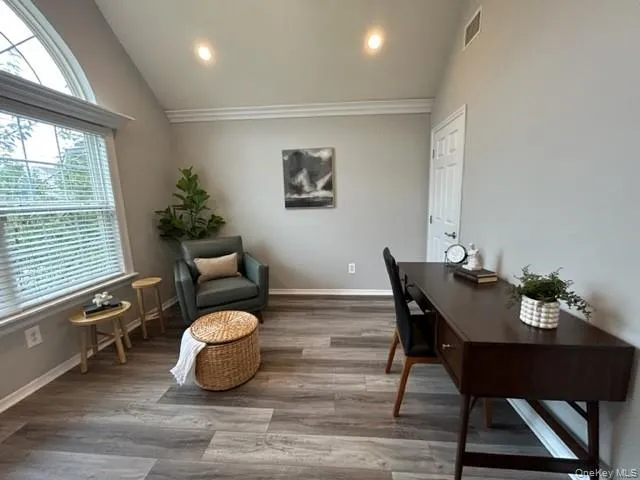 a view of a dining room with furniture window and wooden floor