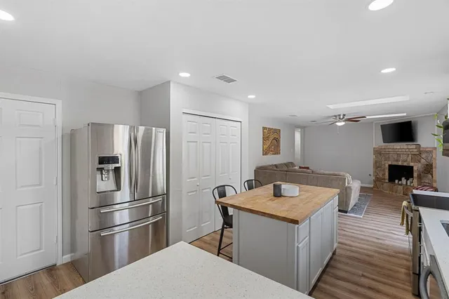 a kitchen with a refrigerator and a sink
