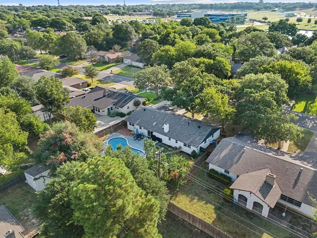 an aerial view of residential house with outdoor space