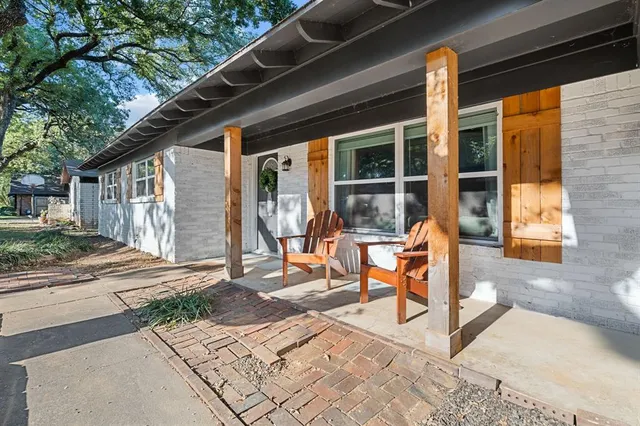 a view of a two chairs in the patio
