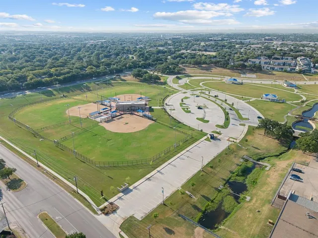 an aerial view of a swimming pool with outdoor space