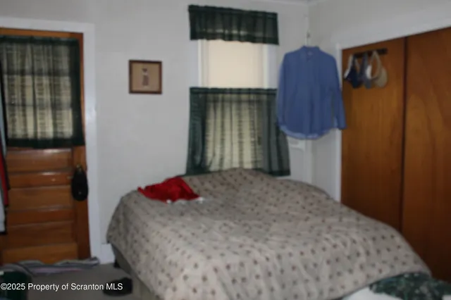 a bedroom with a bed and a cabinets