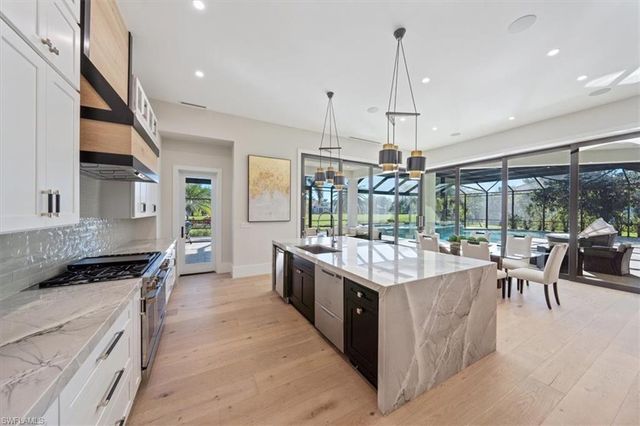 a large kitchen island in the center