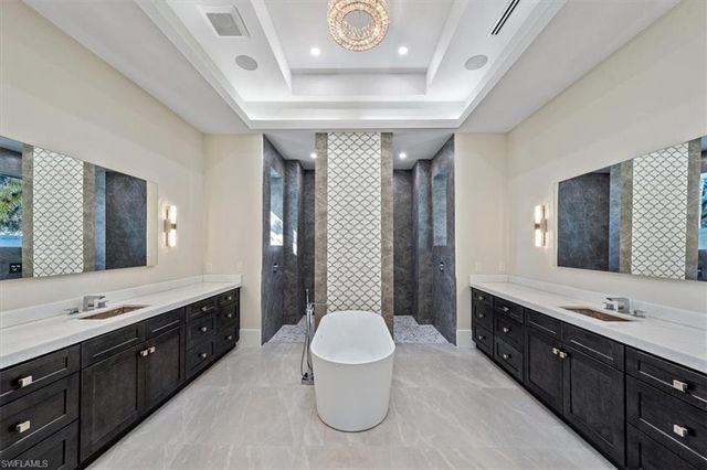 a spacious bathroom with a double vanity sink mirror and toilet