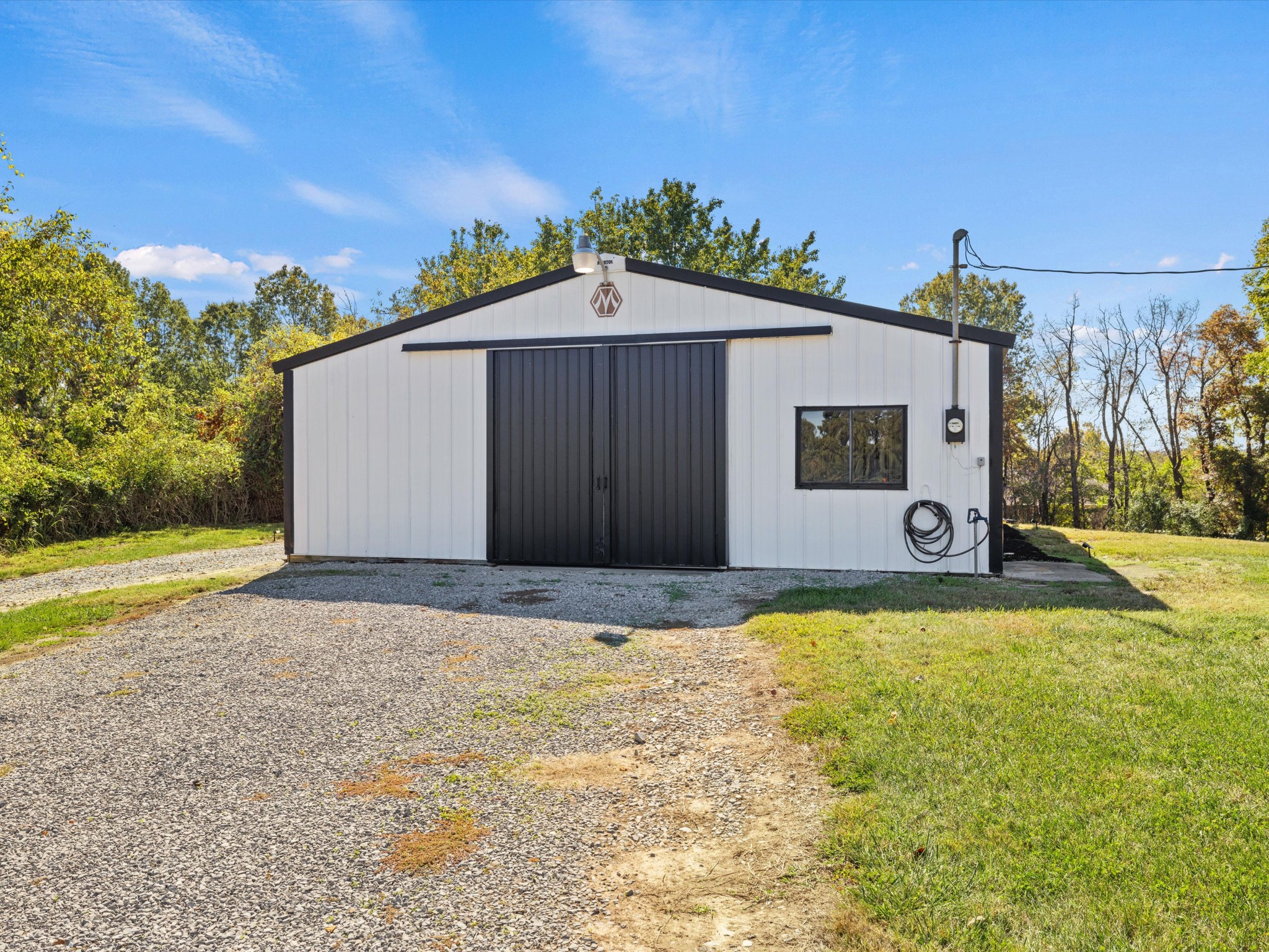 395 Carroll Gentry Road Madisonville, KY 42431 - Photo 35 of 46 a view of a house with a yard