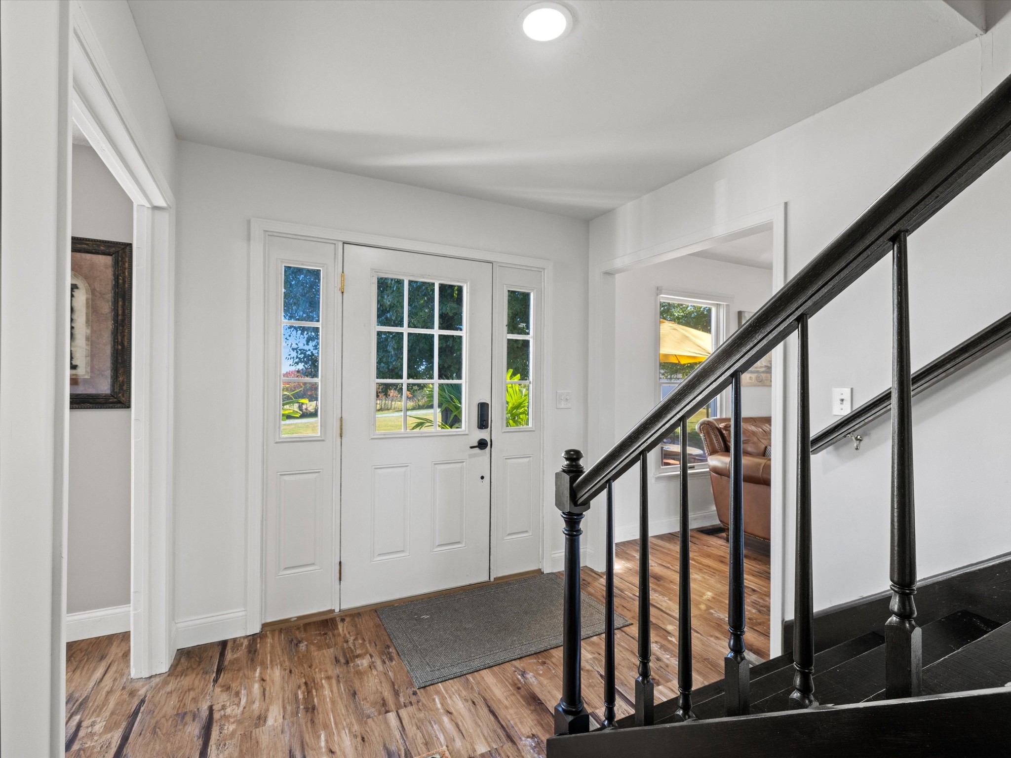 395 Carroll Gentry Road Madisonville, KY 42431 - Photo 5 of 46 a view of an entryway with wooden floor and stairs