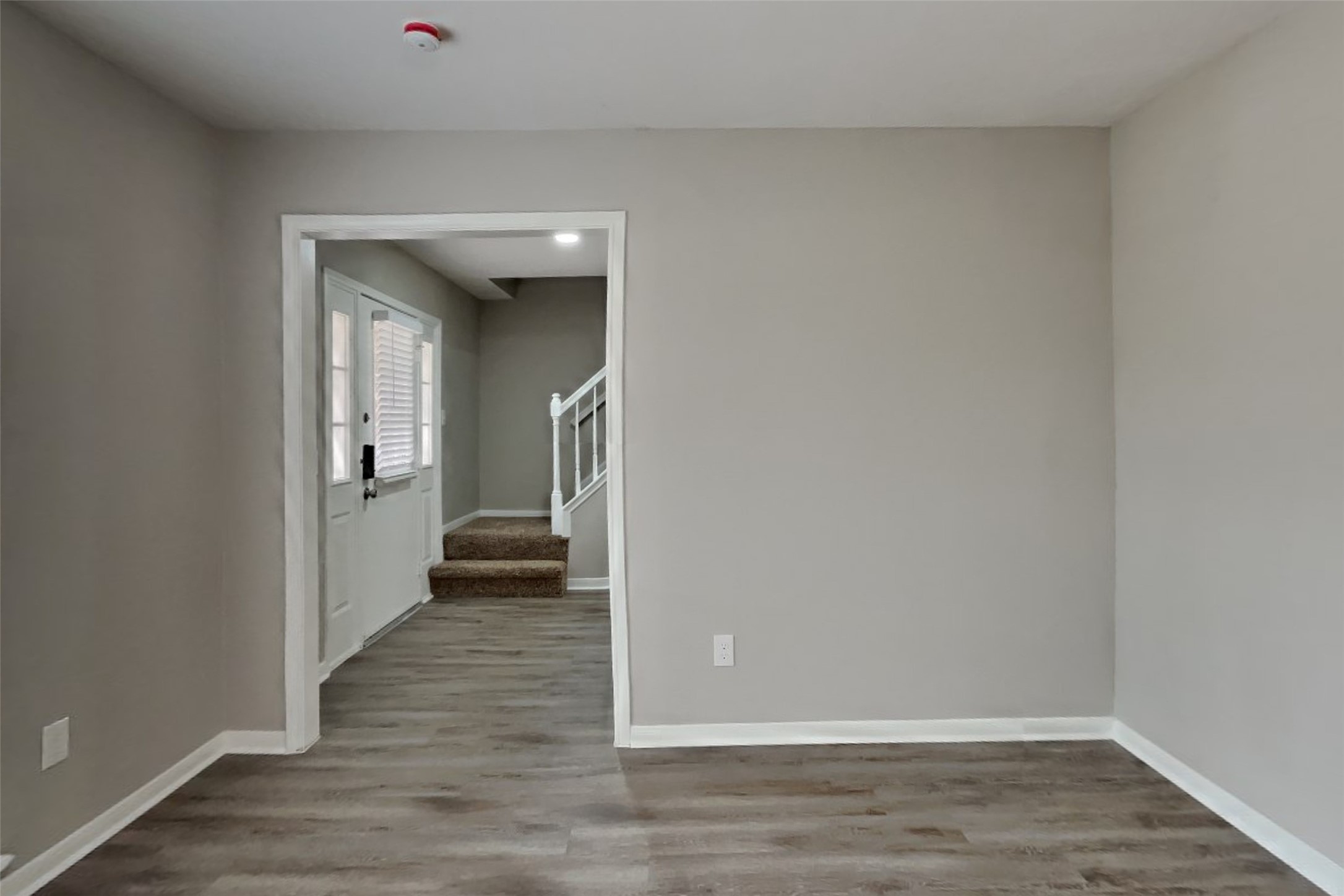 16303 Hickory Point Road Houston, TX 77095 - Photo 2 of 21 a view of a hallway with wooden floor
