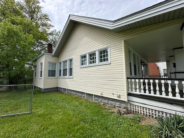 1388 Brookline Road Cleveland, OH 44121 - Photo 27 of 30 View of side of home featuring a lawn