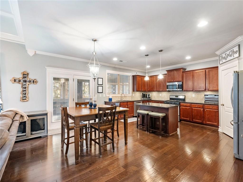 2939 Estate View Court Dacula, GA 30019 - Photo 15 of 73 a view of a dining room with furniture window and wooden floor