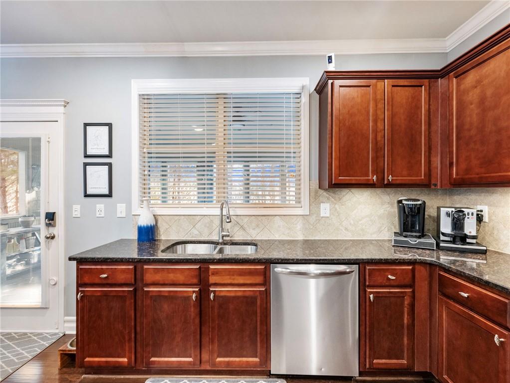 2939 Estate View Court Dacula, GA 30019 - Photo 19 of 73 a kitchen with stainless steel appliances granite countertop a sink a stove cabinets and a counter space