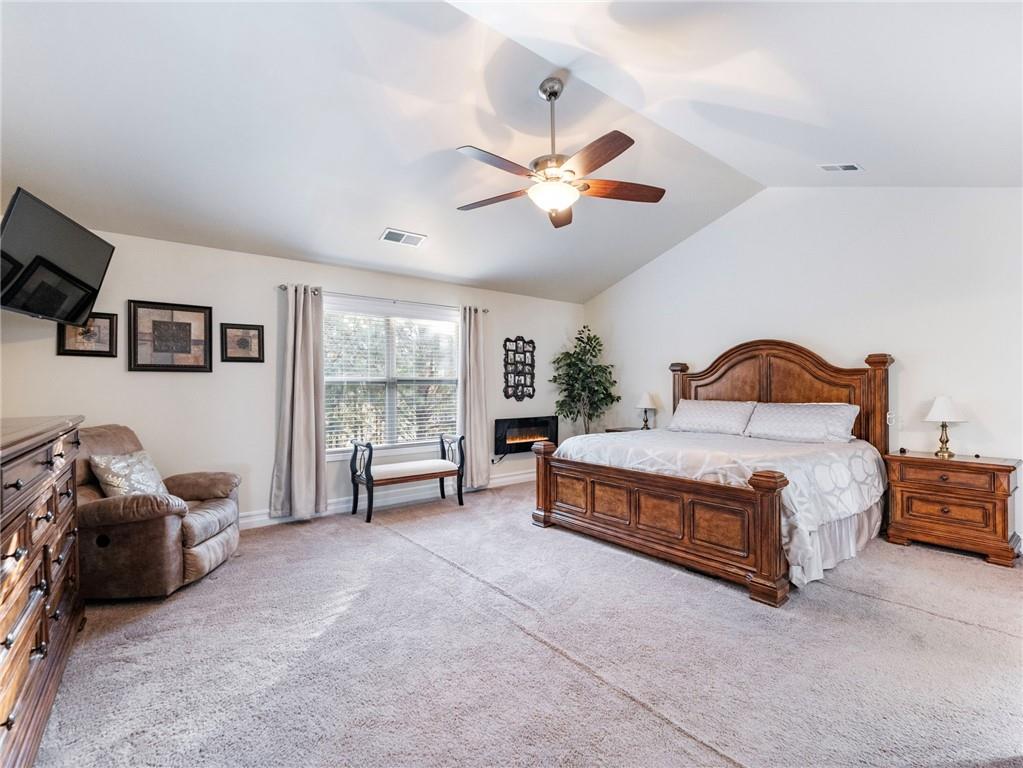 2939 Estate View Court Dacula, GA 30019 - Photo 27 of 73 a spacious bedroom with a bed a couch and a large window