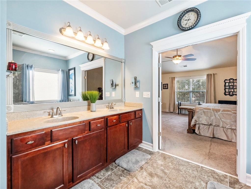 2939 Estate View Court Dacula, GA 30019 - Photo 30 of 73 a spacious bathroom with a double vanity sink and a mirror
