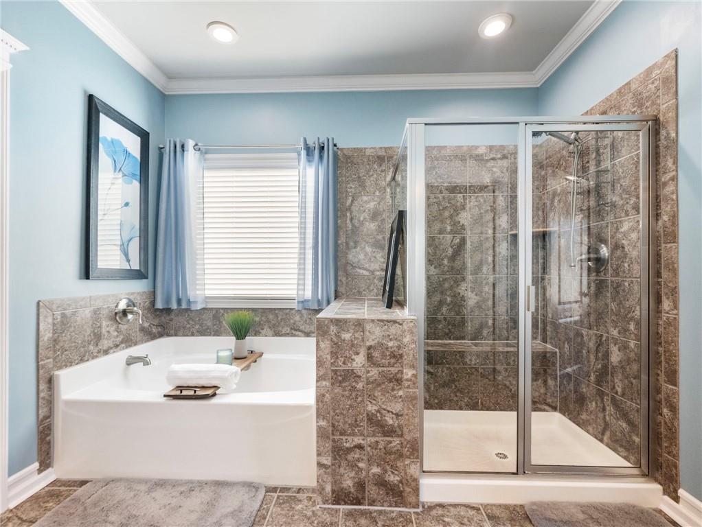 2939 Estate View Court Dacula, GA 30019 - Photo 31 of 73 a bathroom with a granite countertop sink a mirror and shower