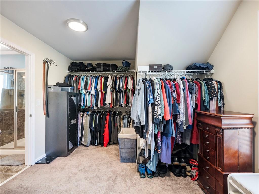 2939 Estate View Court Dacula, GA 30019 - Photo 33 of 73 a view of walk in closet with clothes