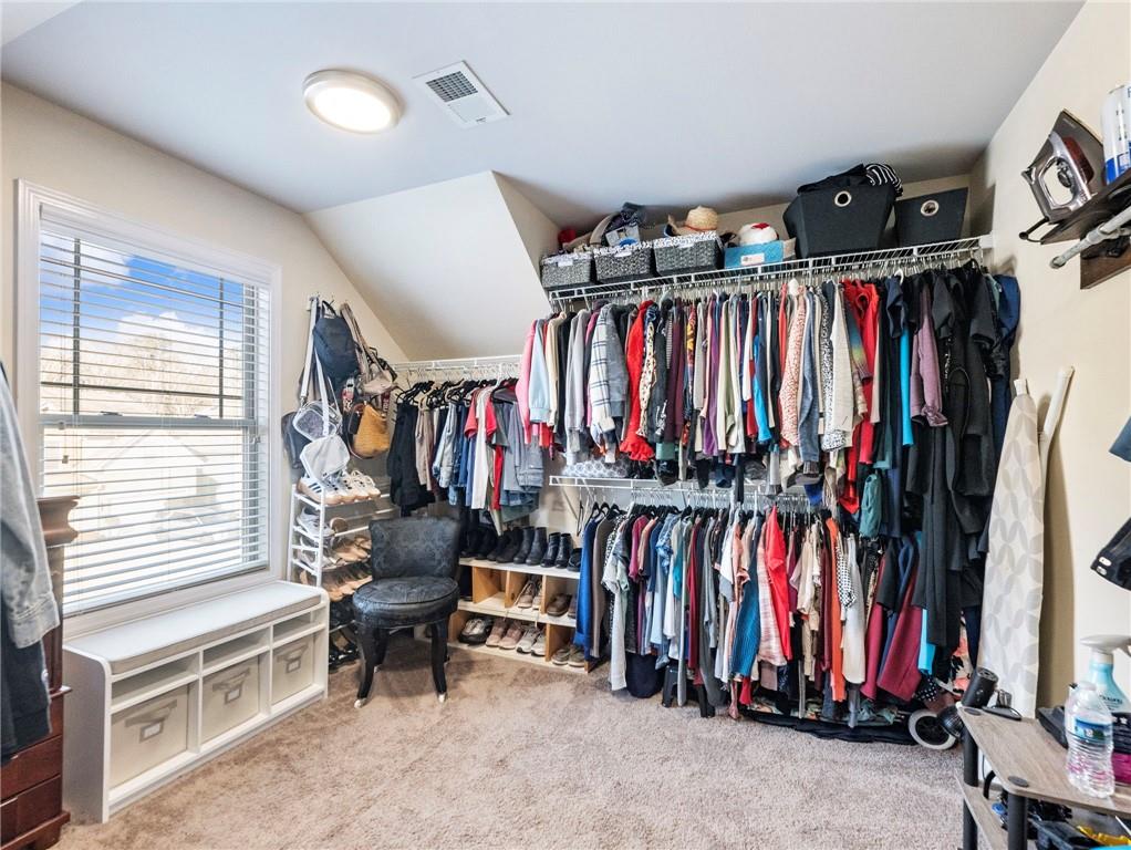2939 Estate View Court Dacula, GA 30019 - Photo 34 of 73 a view of walk in closet with clothes and shoes