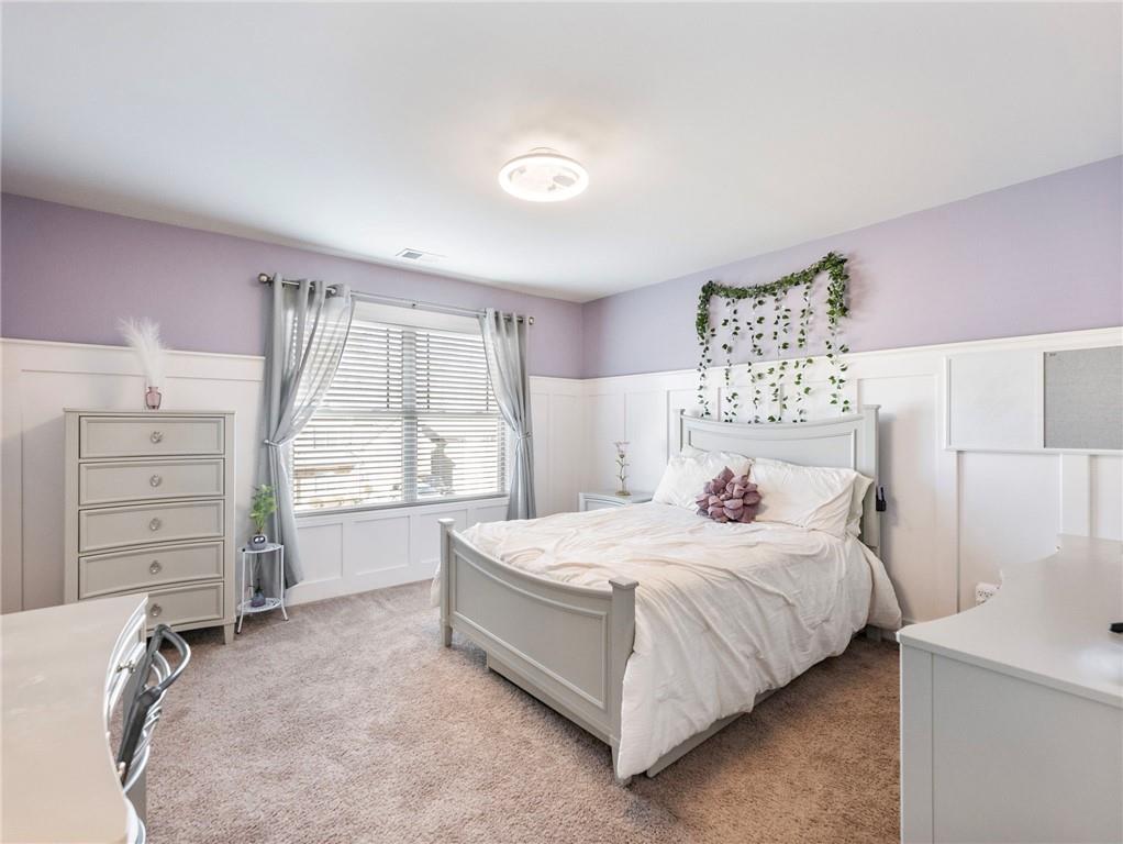 2939 Estate View Court Dacula, GA 30019 - Photo 35 of 73 a bedroom with a bed and a window