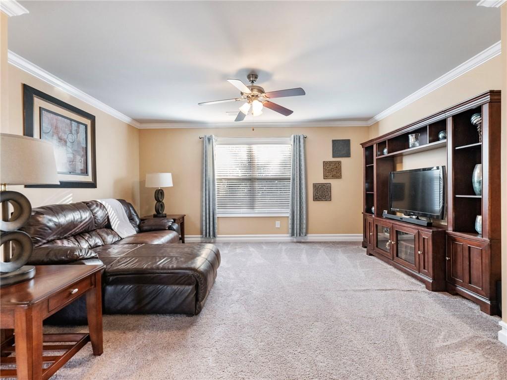 2939 Estate View Court Dacula, GA 30019 - Photo 37 of 73 a living room with furniture and a flat screen tv