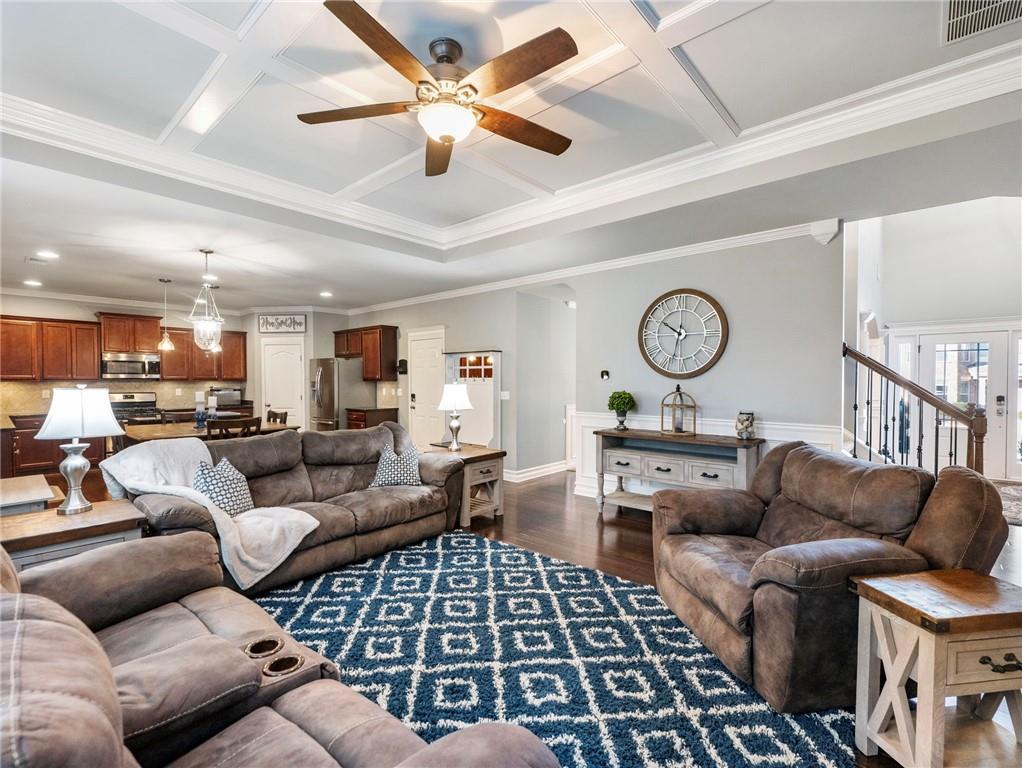2939 Estate View Court Dacula, GA 30019 - Photo 4 of 73 a living room with furniture a clock and a ceiling fan