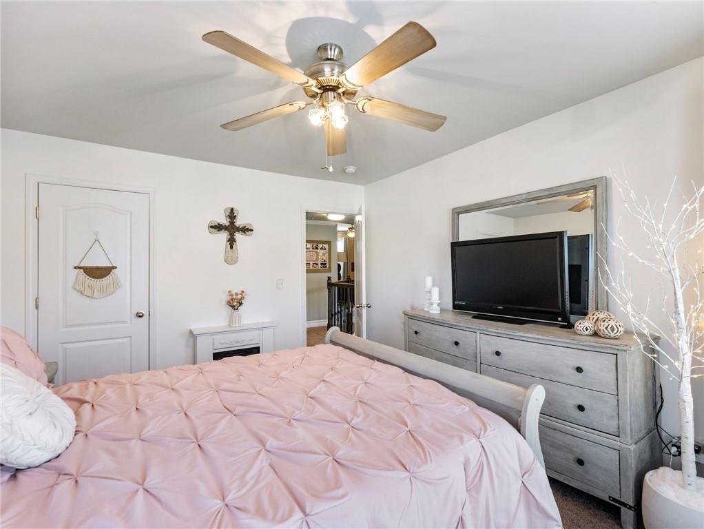 2939 Estate View Court Dacula, GA 30019 - Photo 43 of 73 a bedroom with a bed and a flat screen tv
