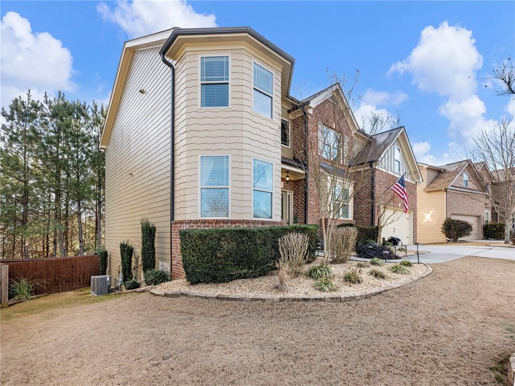 2939 Estate View Court Dacula, GA 30019 - Photo 57 of 73 a front view of a house with a yard