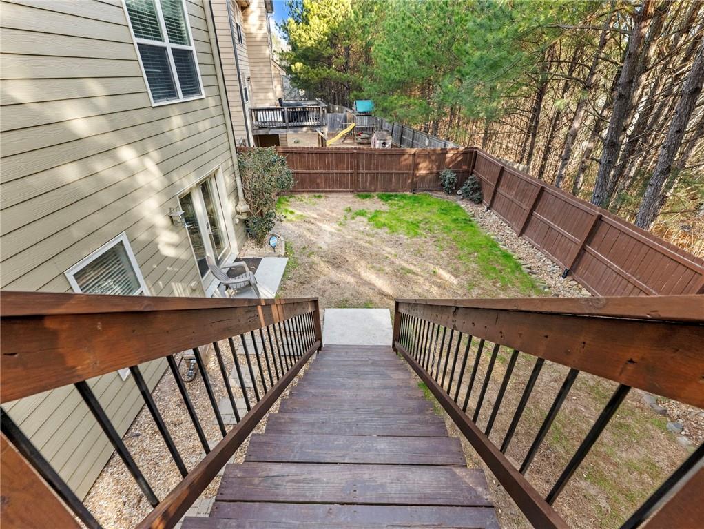 2939 Estate View Court Dacula, GA 30019 - Photo 62 of 73 a view of a balcony with wooden floor