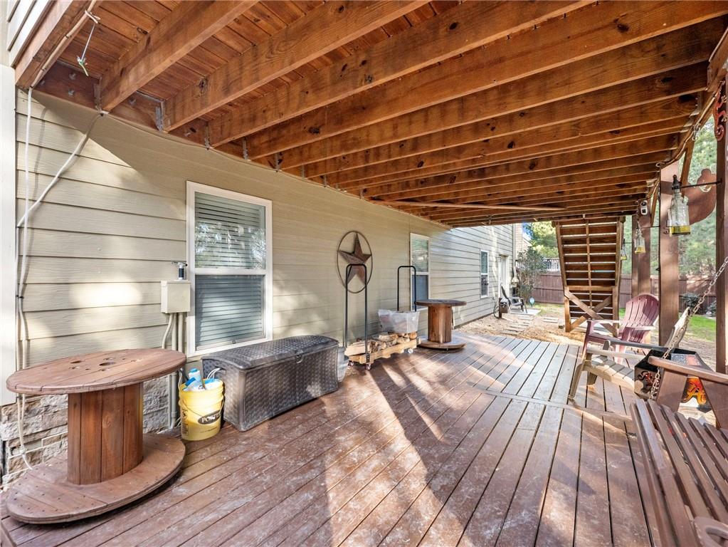 2939 Estate View Court Dacula, GA 30019 - Photo 65 of 73 a view of a patio with table and chairs with wooden floor