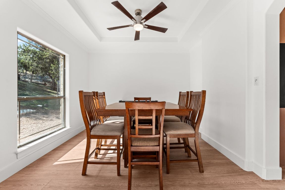 14000 Saskatchewan Drive Austin, TX 78734 - Photo 12 of 27 a view of a dining room with furniture window and wooden floor
