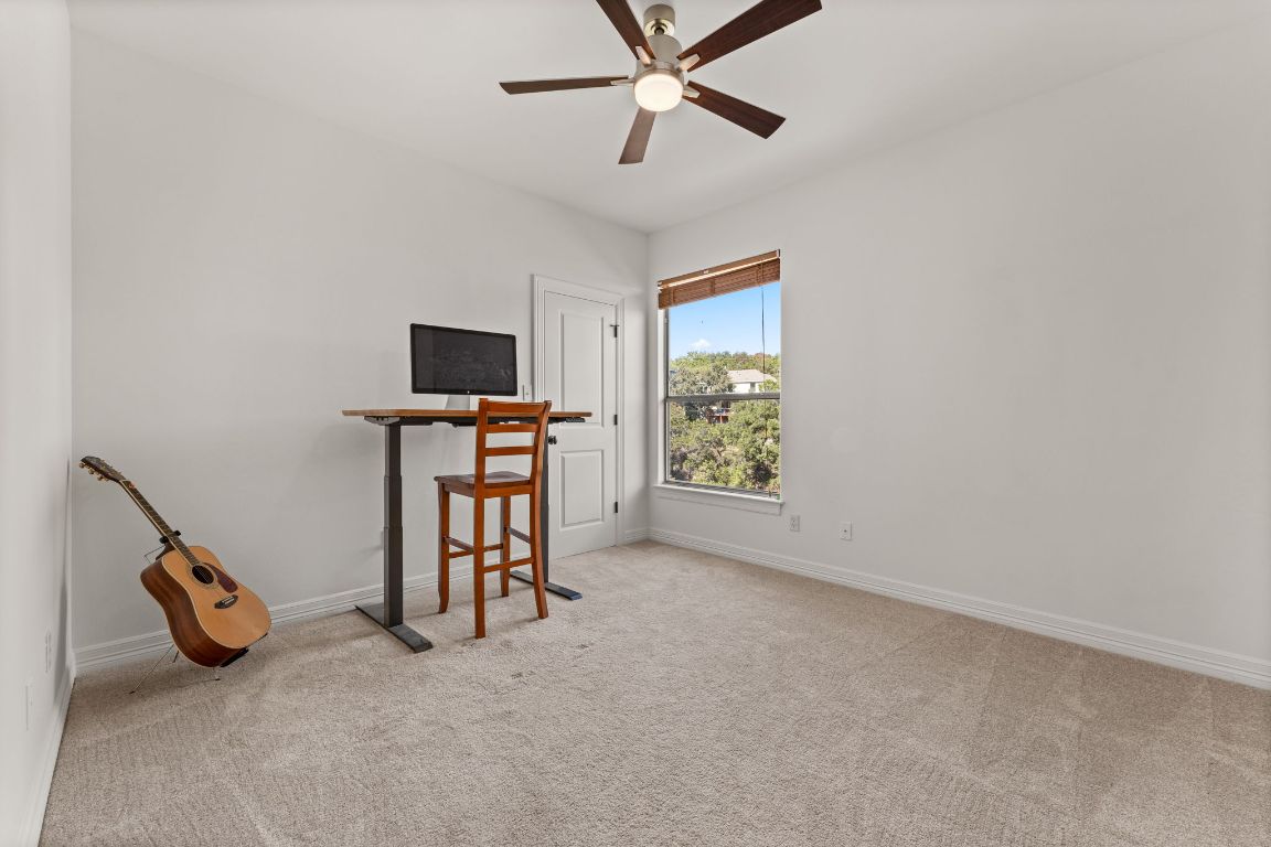 14000 Saskatchewan Drive Austin, TX 78734 - Photo 18 of 27 a view of a livingroom with furniture and a ceiling fan