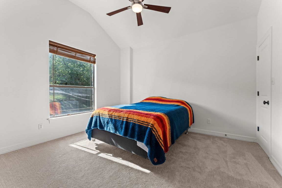 14000 Saskatchewan Drive Austin, TX 78734 - Photo 20 of 27 a bed sitting in a room next to a window