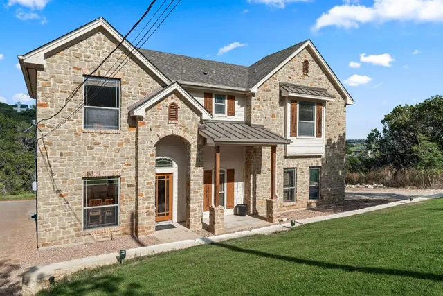 a front view of a house with a yard