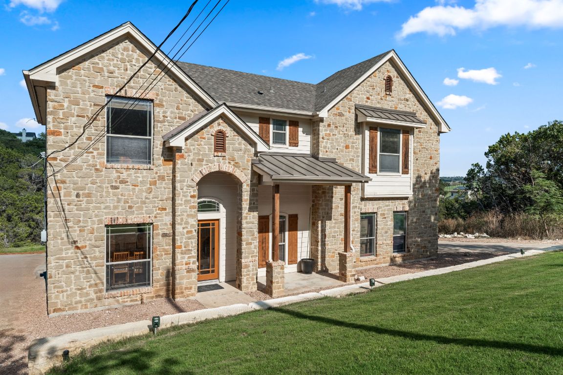 14000 Saskatchewan Drive Austin, TX 78734 - Photo 3 of 27 a front view of a house with a yard