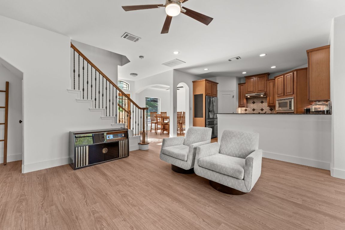 14000 Saskatchewan Drive Austin, TX 78734 - Photo 5 of 27 a living room with furniture and a fireplace