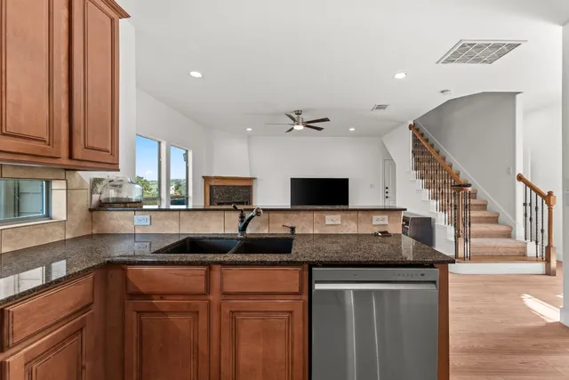 a kitchen with granite countertop a sink and a granite counter tops