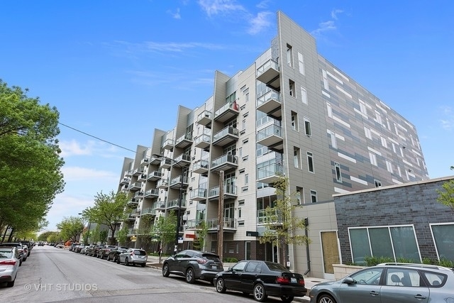 a city street lined with buildings and cars