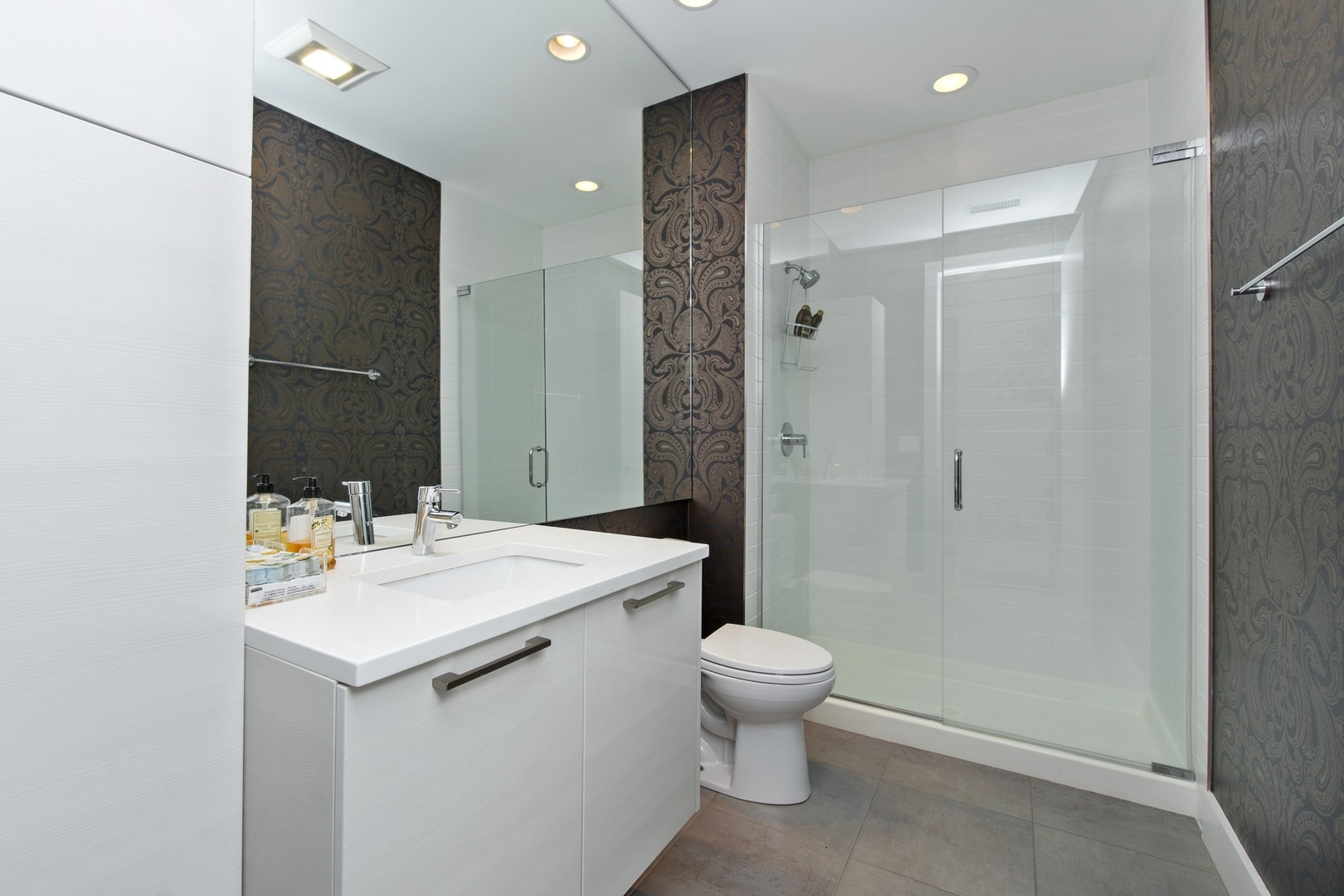 1124 West Adams Street, Unit PHW Chicago, IL 60607 - Photo 17 of 55 a bathroom with a sink toilet and shower