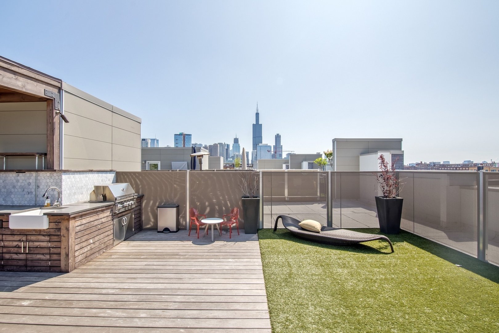 1124 West Adams Street, Unit PHW Chicago, IL 60607 - Photo 22 of 55 a view of a balcony with two chairs and a table
