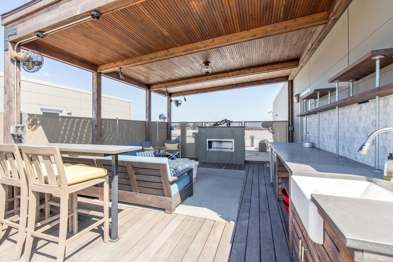 1124 West Adams Street, Unit PHW Chicago, IL 60607 - Photo 23 of 55 a view of a chairs and table on the wooden floor