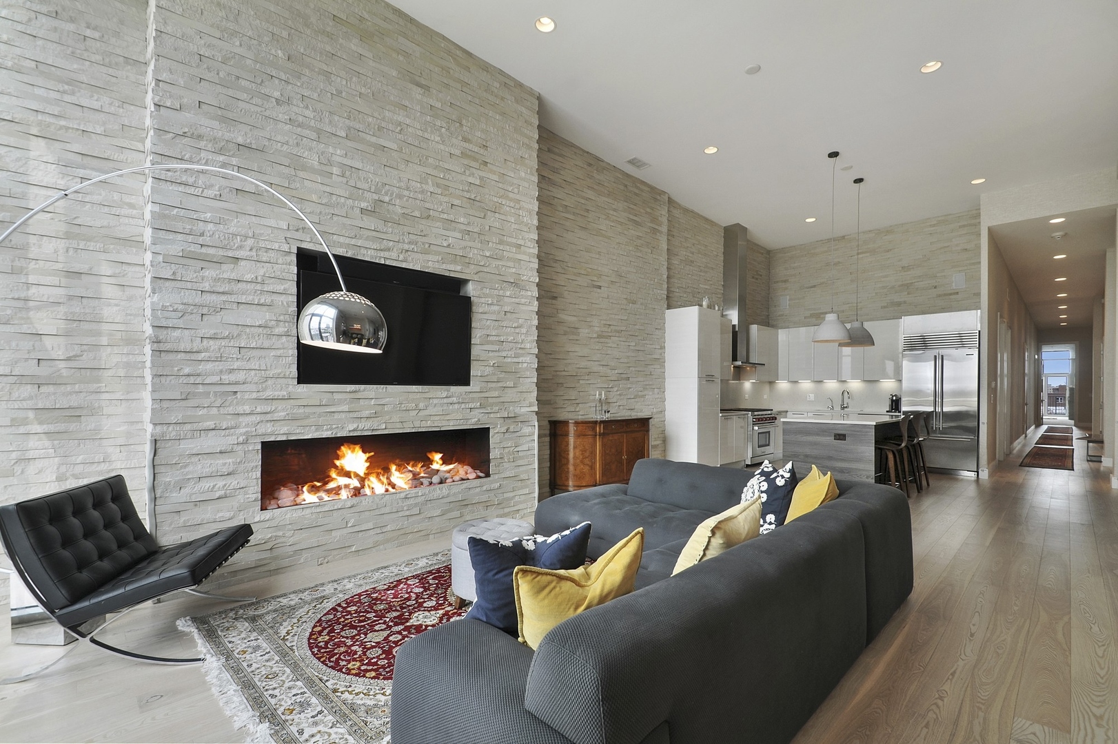 1124 West Adams Street, Unit PHW Chicago, IL 60607 - Photo 26 of 55 a living room with furniture and a fireplace